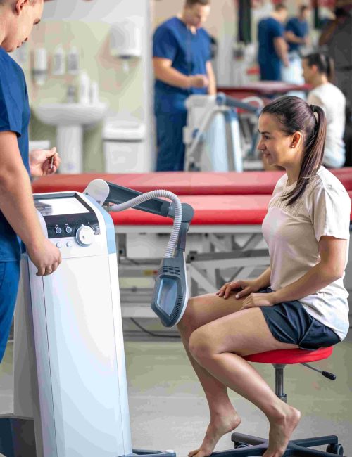 doctor-using-machine-to-treat-the-knee-joints-of-a-2025-03-16-11-25-51-utc